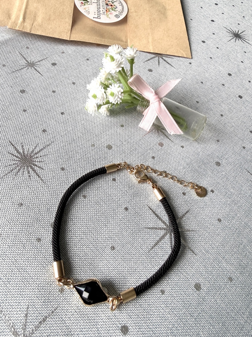 Black Milan cord bracelet featuring a central diamond-shaped (kite-cut)